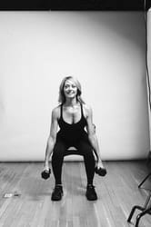 Weighted Chair Squat - Photo 2