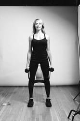 Weighted Chair Squat - Photo 3
