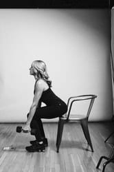 Weighted Chair Squat - Photo 6