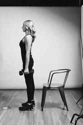 Weighted Chair Squat - Photo 7